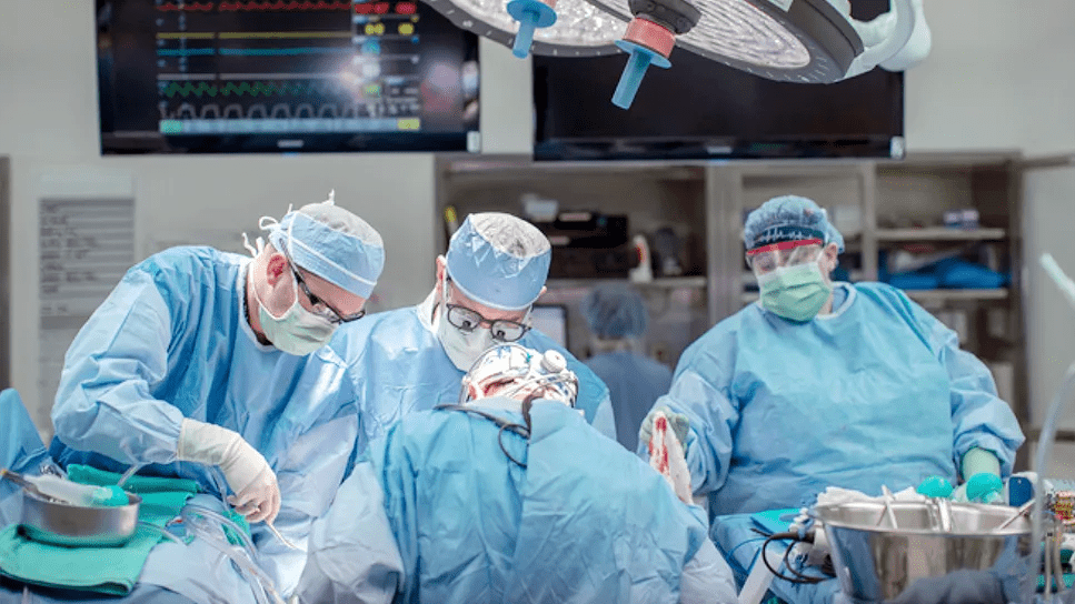 surgical team working at the operating table in an operating room