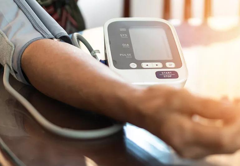 man performing a blood pressure check