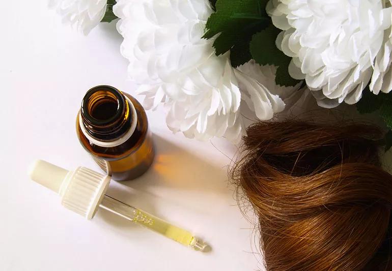 Bottle of argan oil with eye dropper for hair.