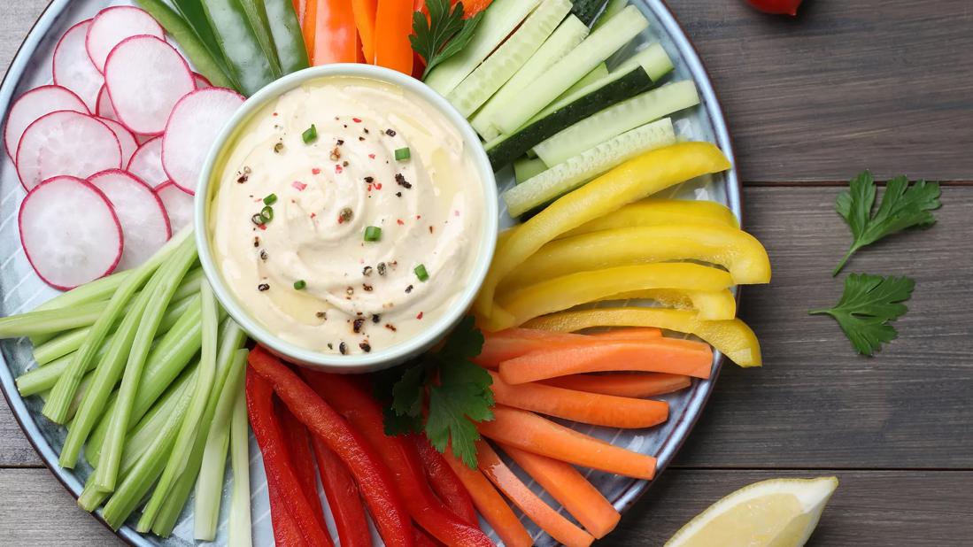 Veggie tray with cream cheese dip in center of tray