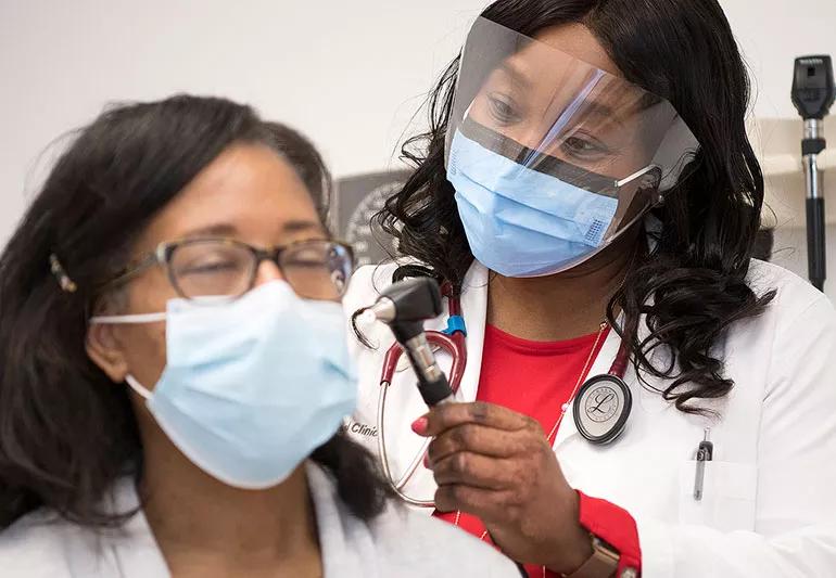 woman at wellness visit with doctor