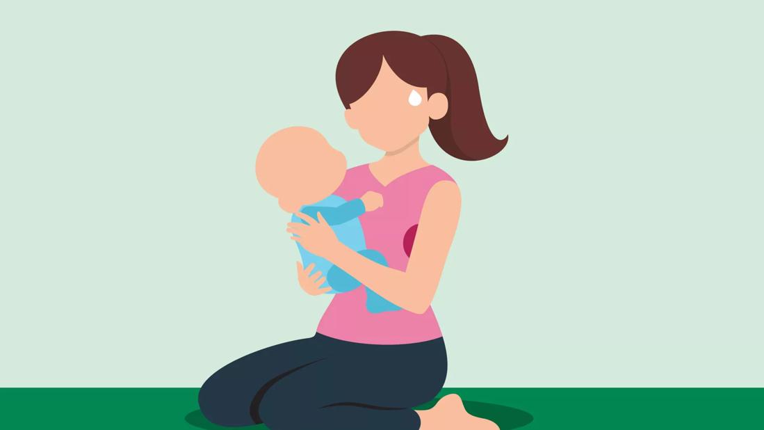 Mother holding child with sweat stain and sweat drop from forehead