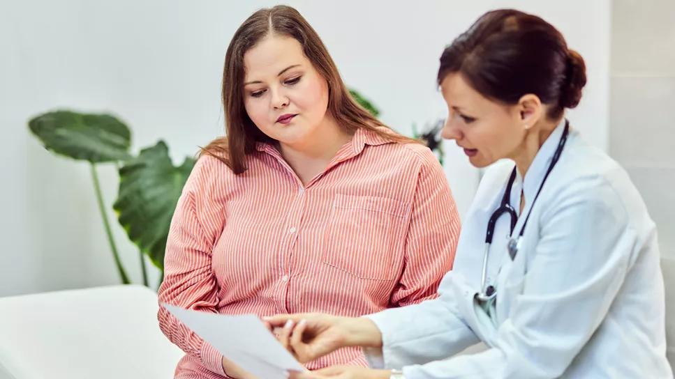 Physician consulting with patient on weight-management