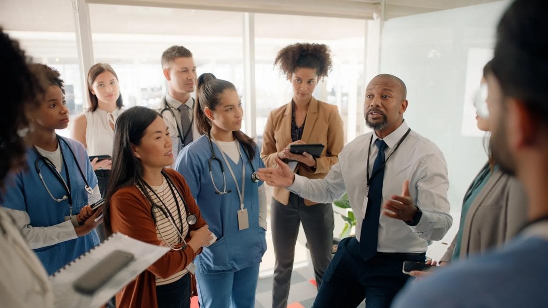 Healthcare workers standing around in a group