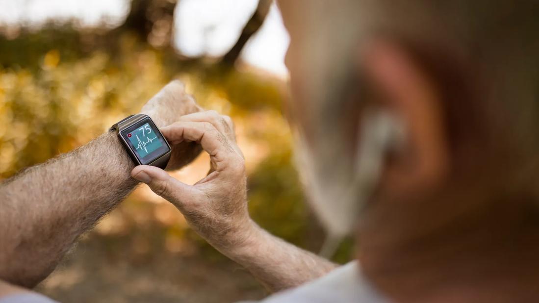 Person checking their heart rate on smartwatch
