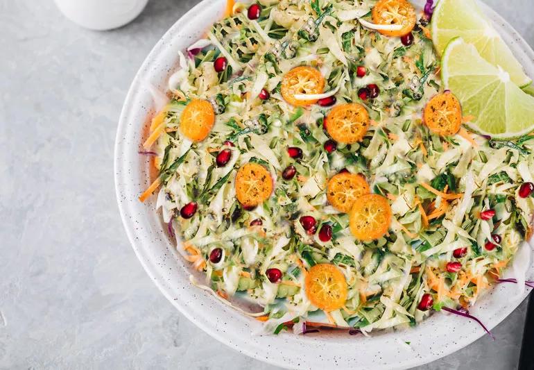 Cole slaw with kumquates and pomegranate seeds