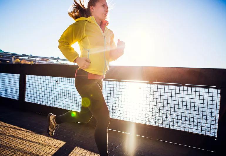 Woman exercising at dawn or dusk