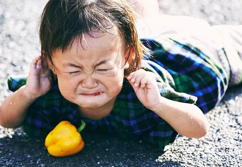 Child crying with split lip