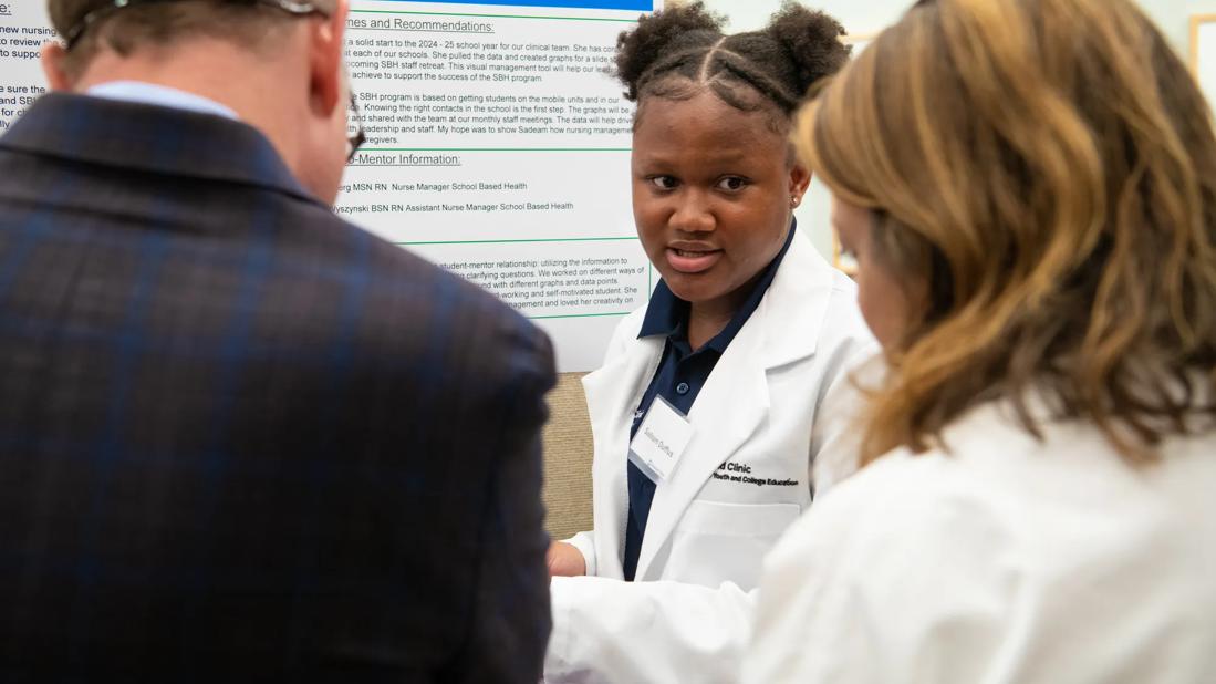 Student presenting poster during internship