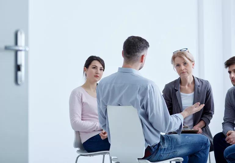 Man speaking in cancer support group