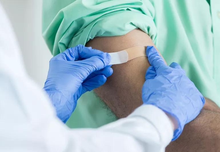 Man getting a shot to help against pneumonia