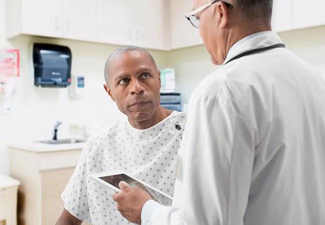 Doctor comforting patient in office