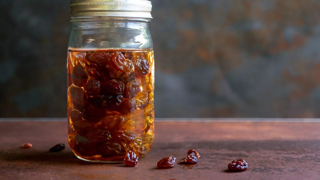 Mason jar filled with water and raisins