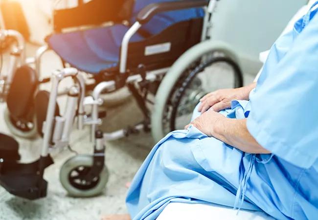 Asian senior or elderly old lady woman patient sitting on bed with electric wheelchair at nursing hospital ward : healthy strong medical concept