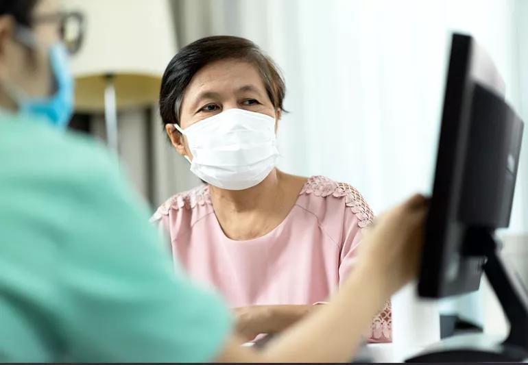 woman in doctor's office finding out about SIS procedure