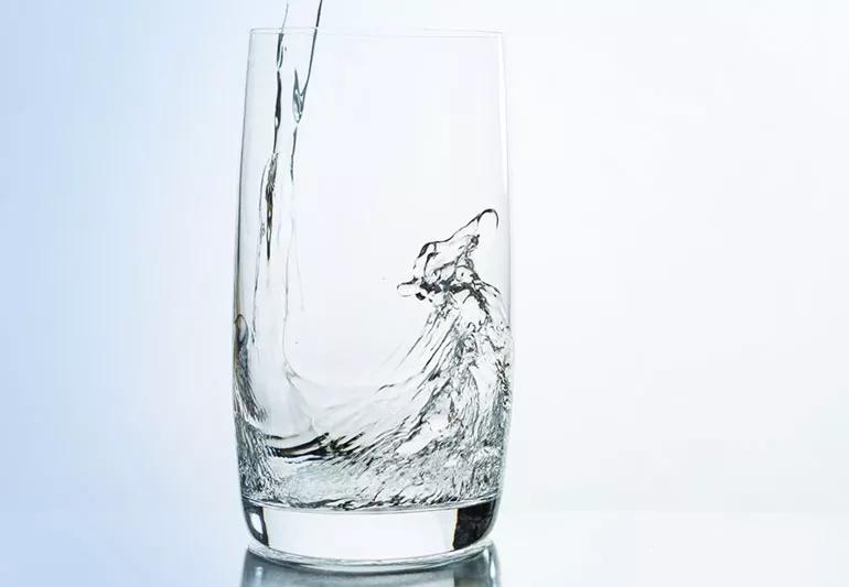 Water being poured into a glass.