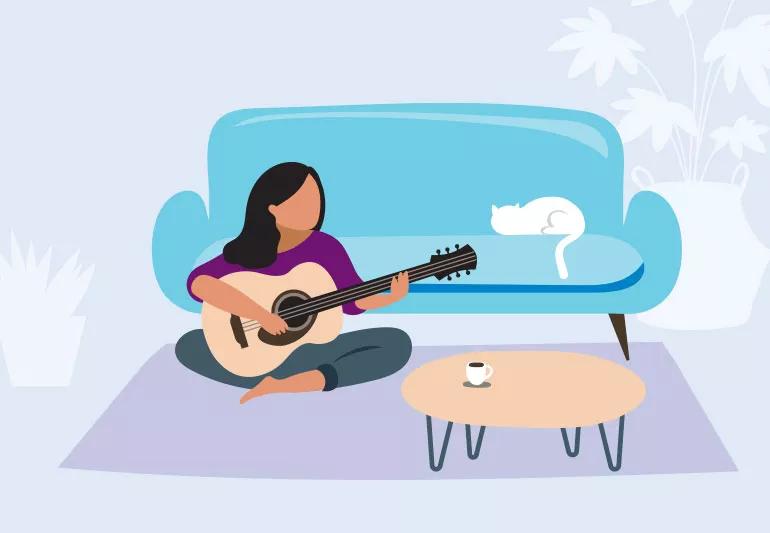woman relaxing and playing guitar