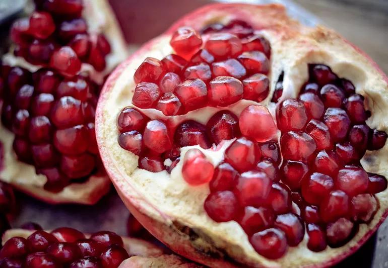 opened pomegranate with seeds
