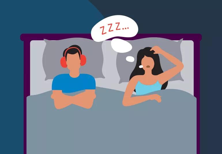 couple in bed woman snoring