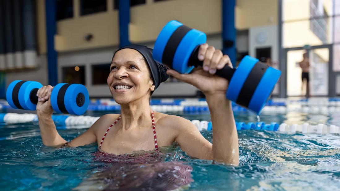 Elderly woman doing water aerobics