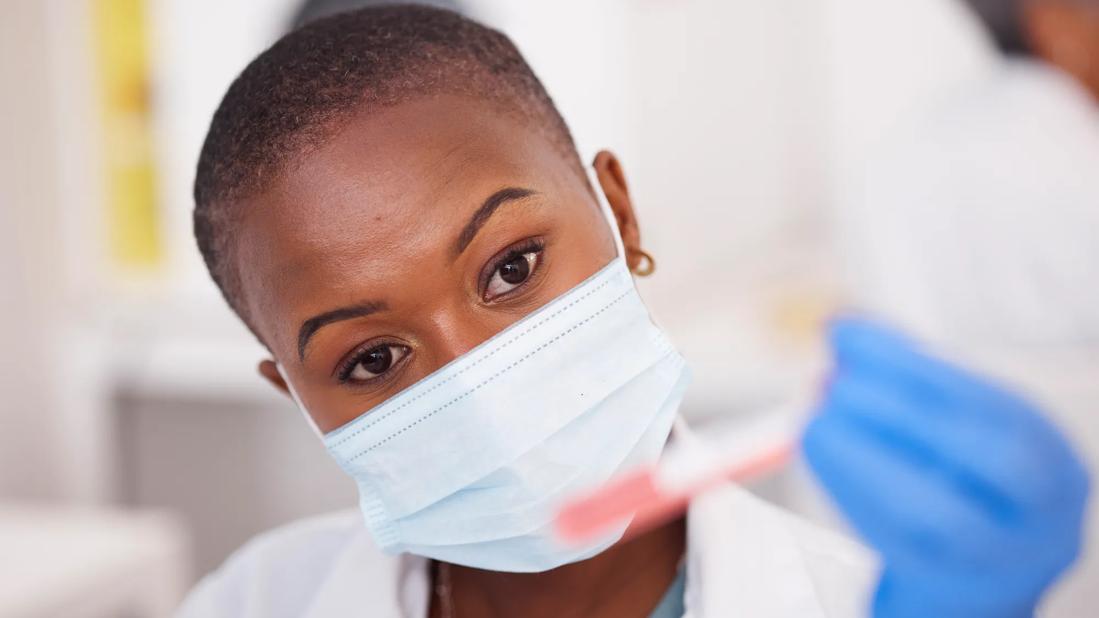 Nurse researcher with test tube