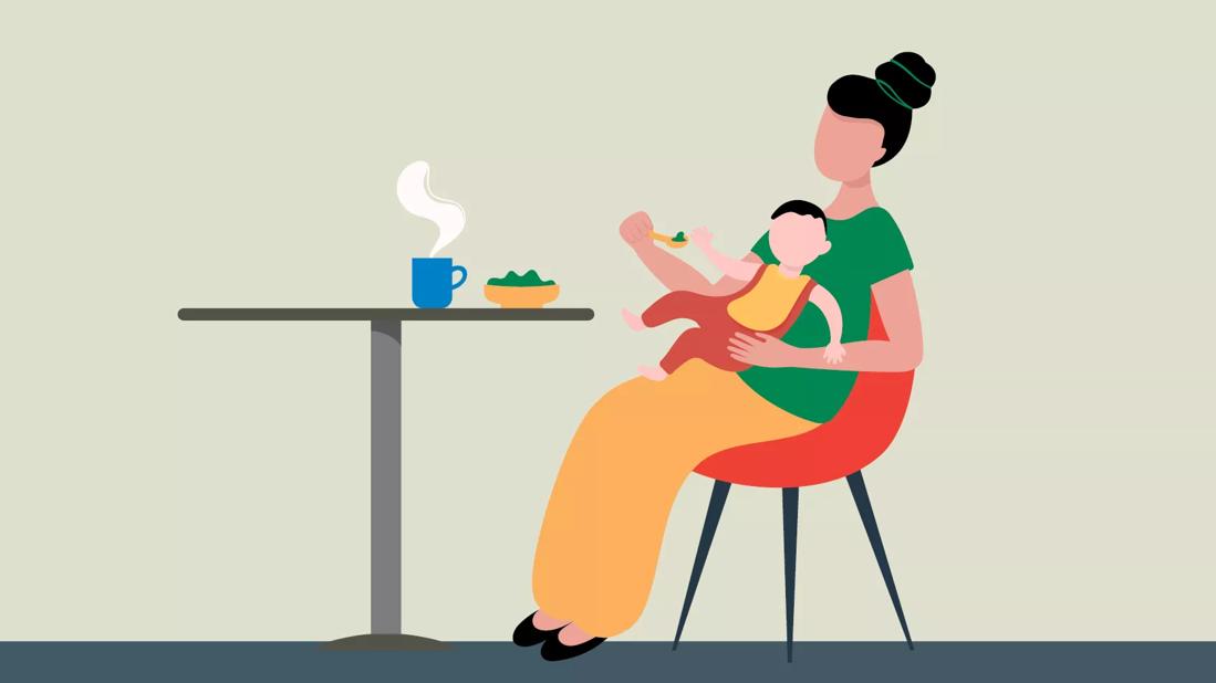 An illustration of an adult feeding a child