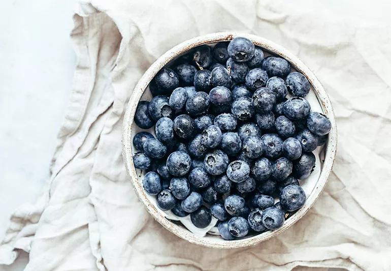 A close up of blueberries in a bowl