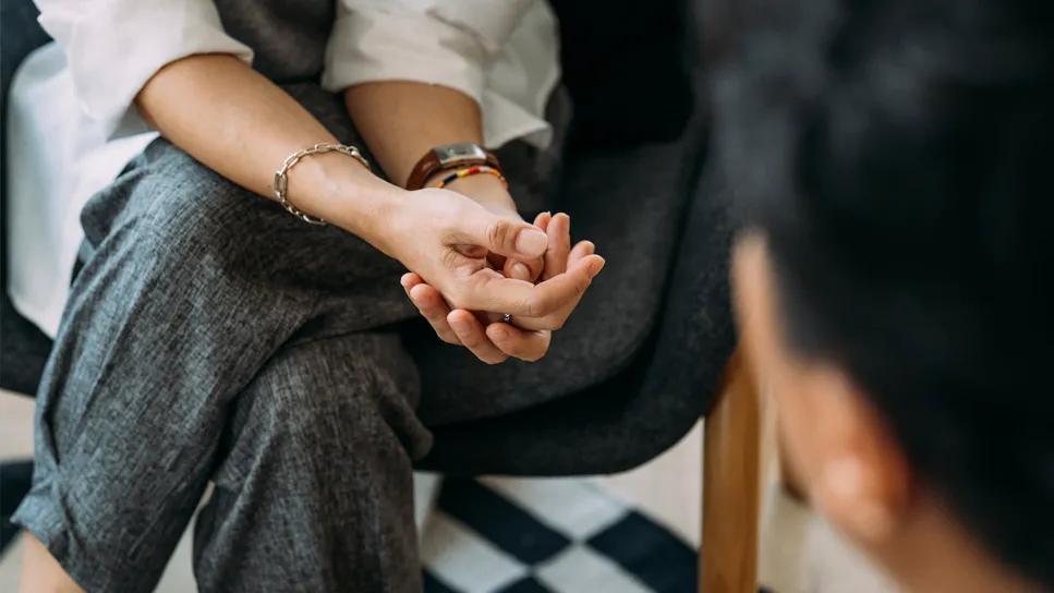 Two nurses talking about a patient's case