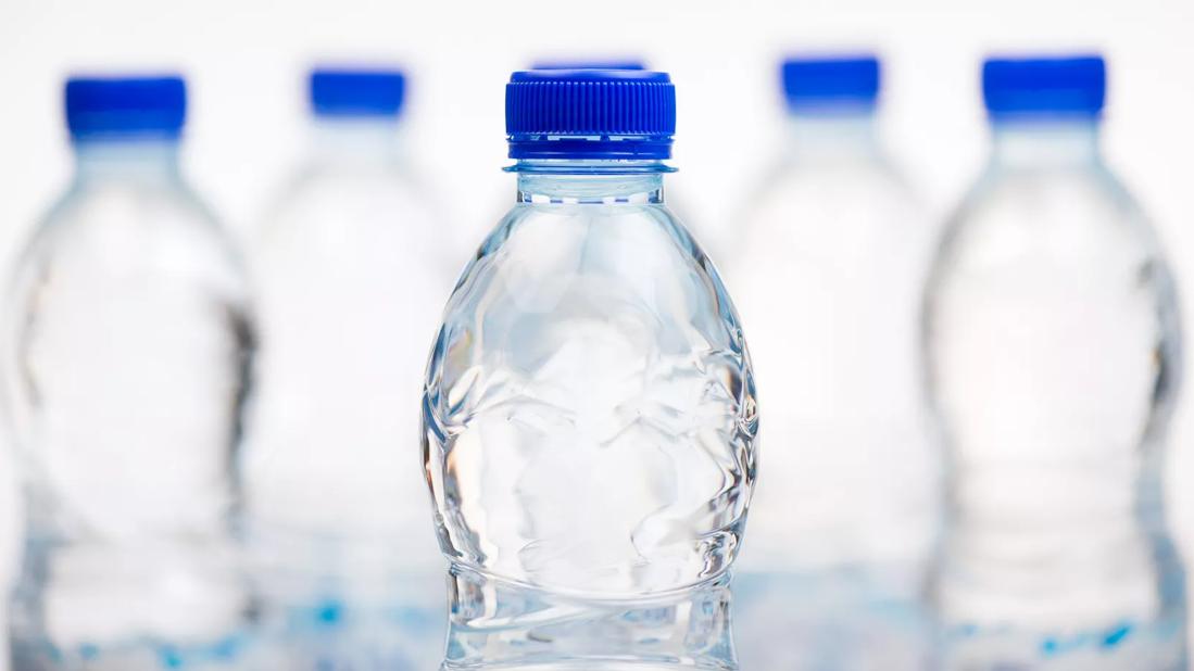 Bottles of water with blue caps