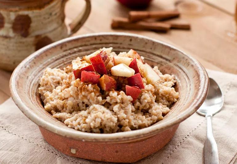a bowl of oatmeal topped with fruit is good for lowering cholesterol
