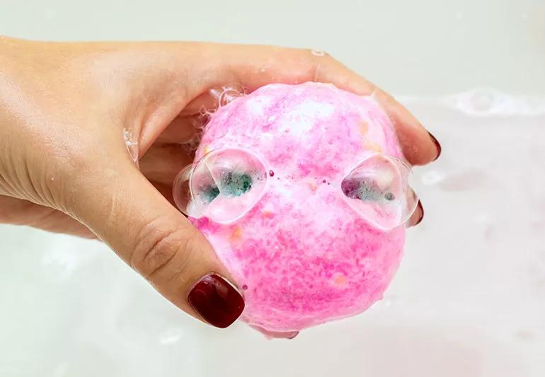 Woman holding a bath bomb