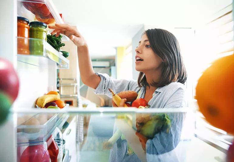 woman raiding the fridge on the weekend