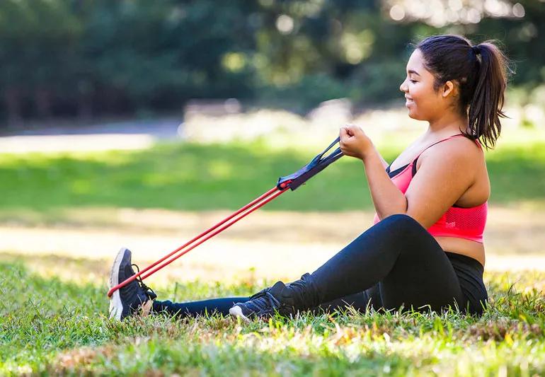 Woman using resistance band for training