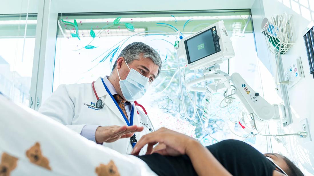 Clinician looking down at patient on exam table