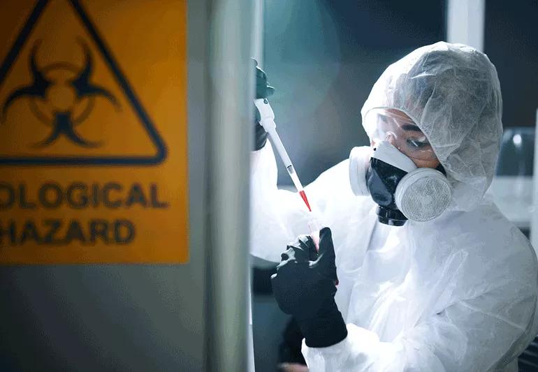 Healthcare worker dressed in protective clothing dealing with ebola virus