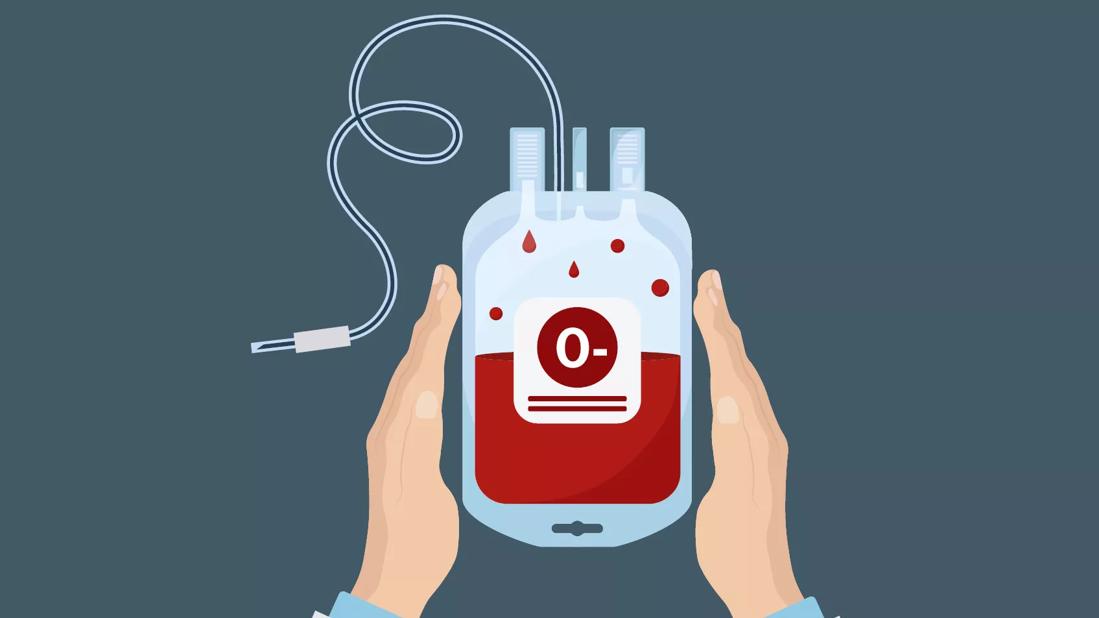 A person holding a blood bag that is labeled O negative blood