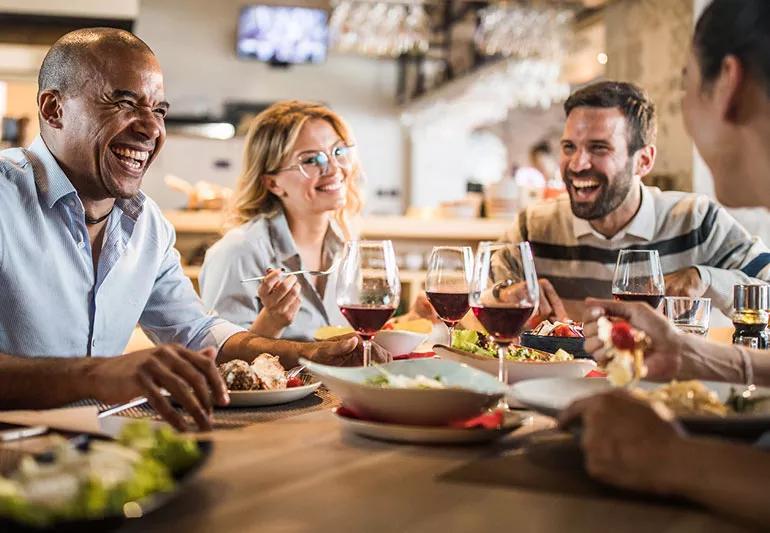 Friends having dinner together at a restaurant