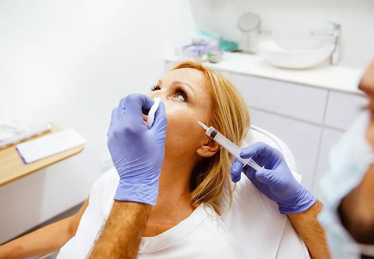 A person receiving injections in a doctor's office