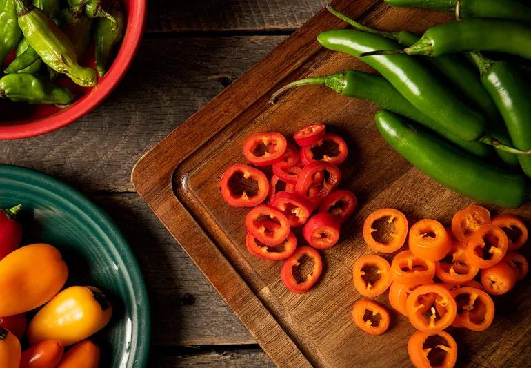 spicey peppers on chopping block