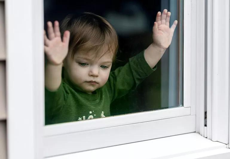 Little girl stuck inside house without friends