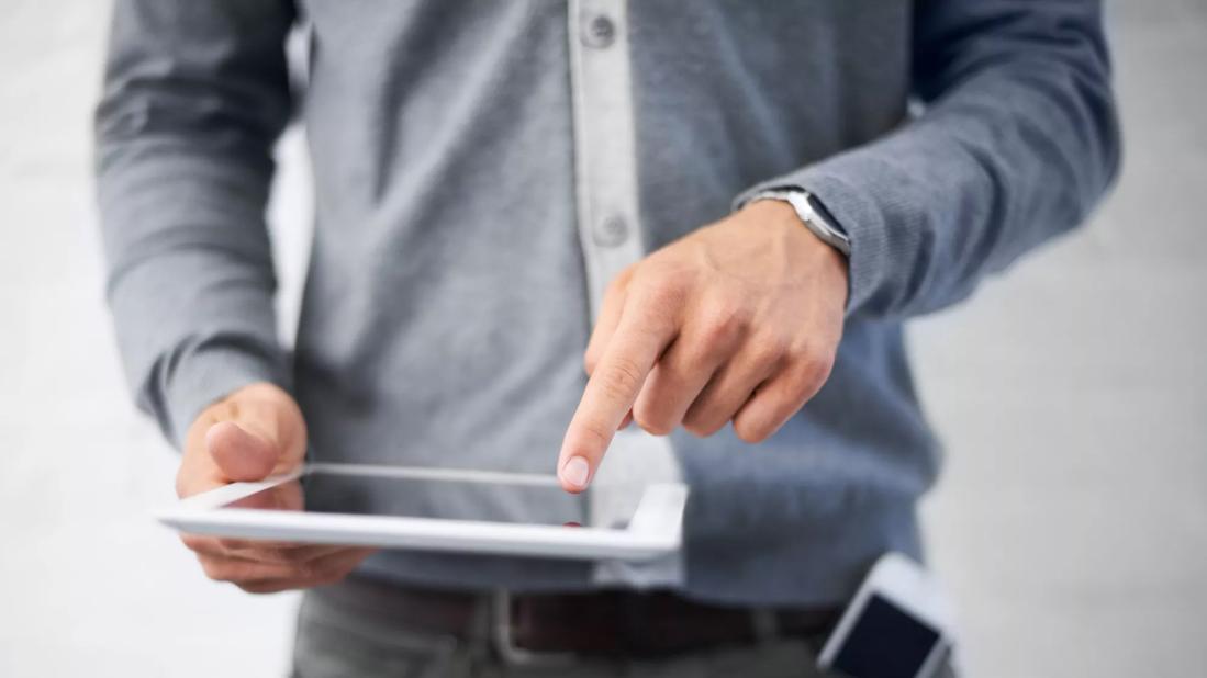 Man pointing to test results on a tablet