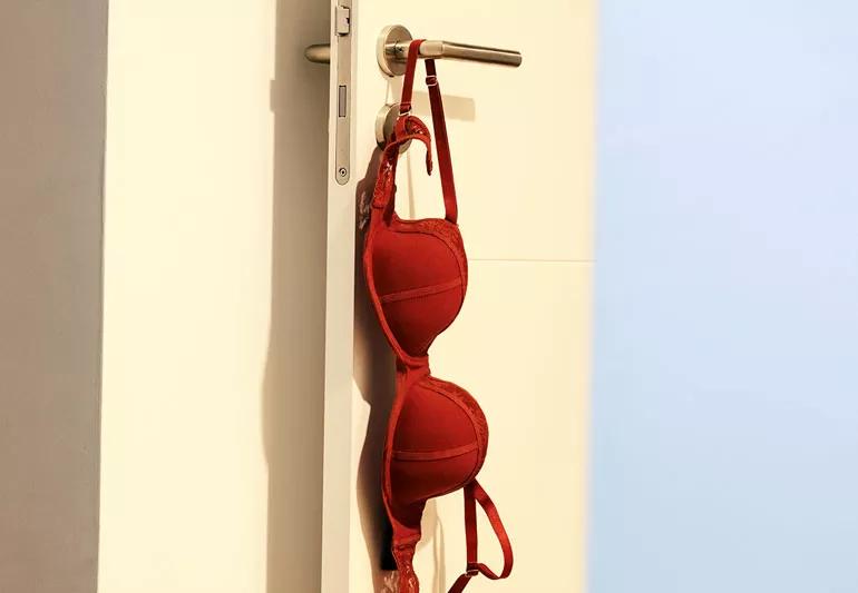 bra hanging from doorknob