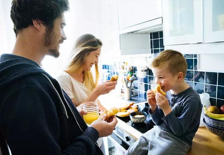 family eating breakfast in the kitchen