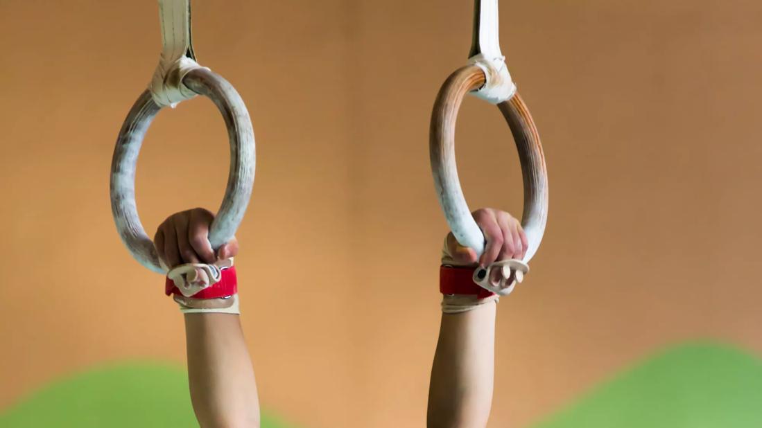 Gymnast holding onto rings