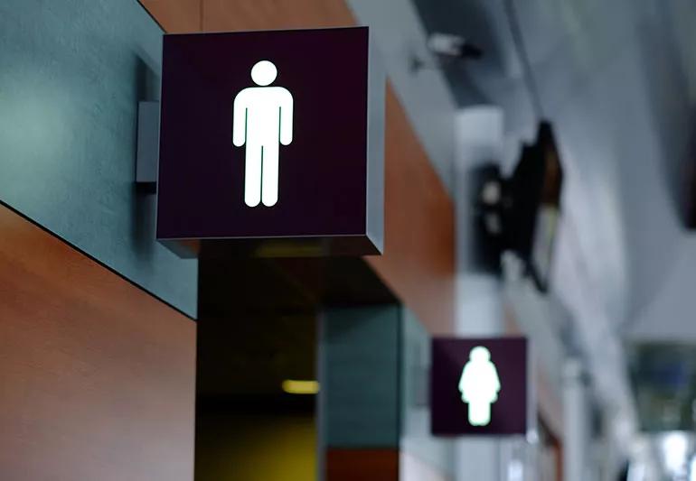 Zoom in on men's restroom sign.