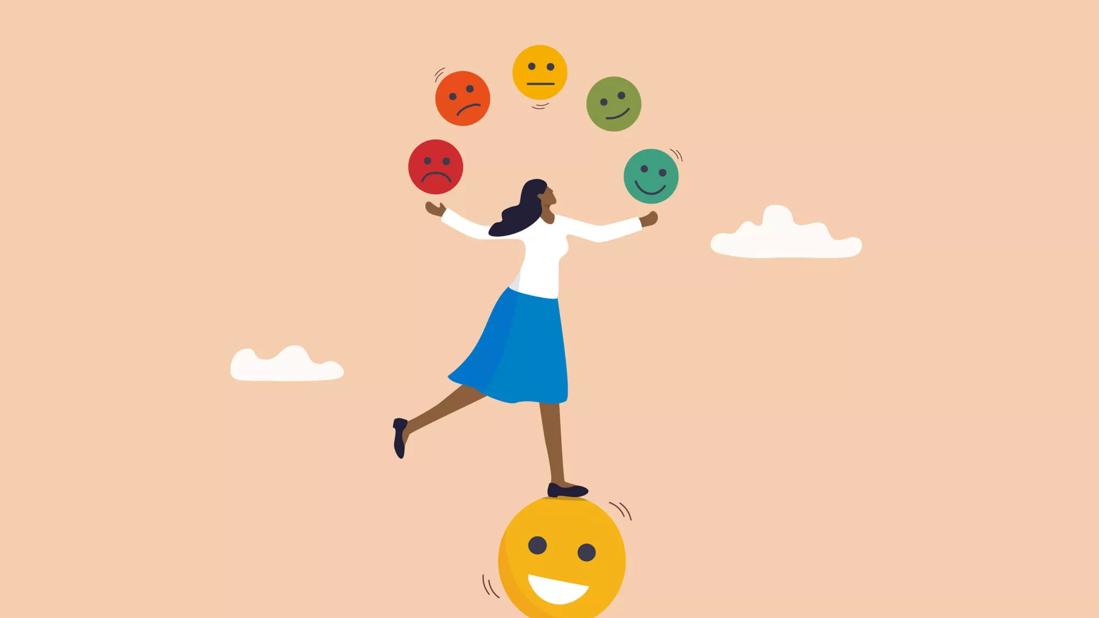 person balancing on a smiley face while juggling other emotions