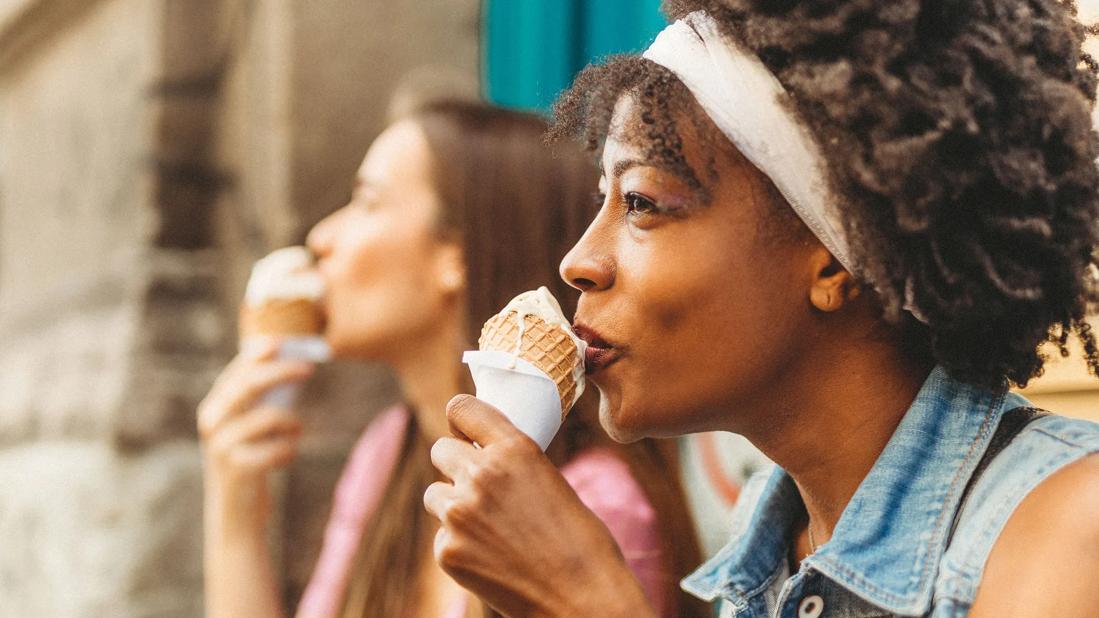 Two people enjoying ice cream cones