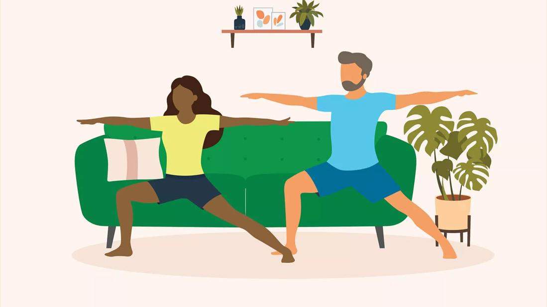 A couple doing yoga.