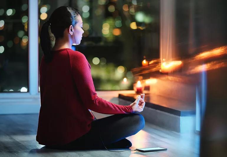 woman practicing yoga before bed