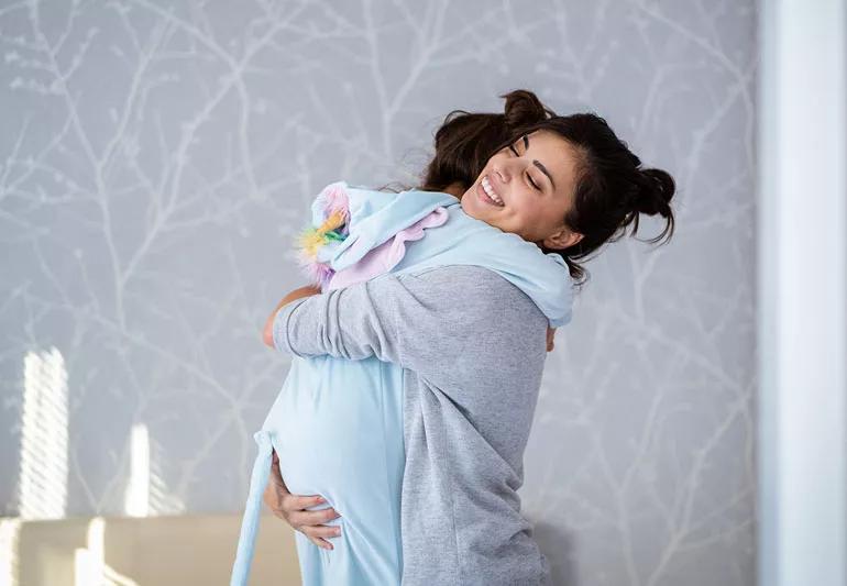 Mother hugging daughter, counting her blessings